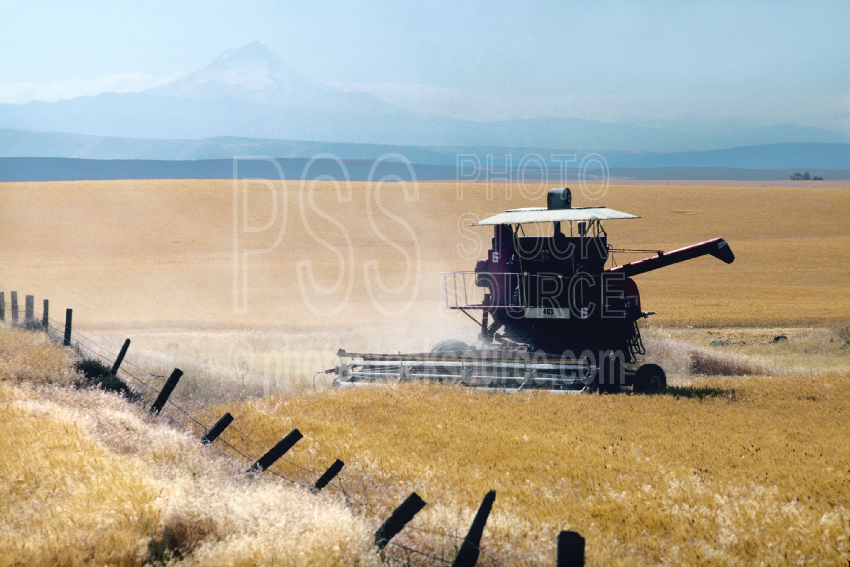 Combine and Wheatfield,mt. hood,combine,harvest,wheatfield,usas,agriculture