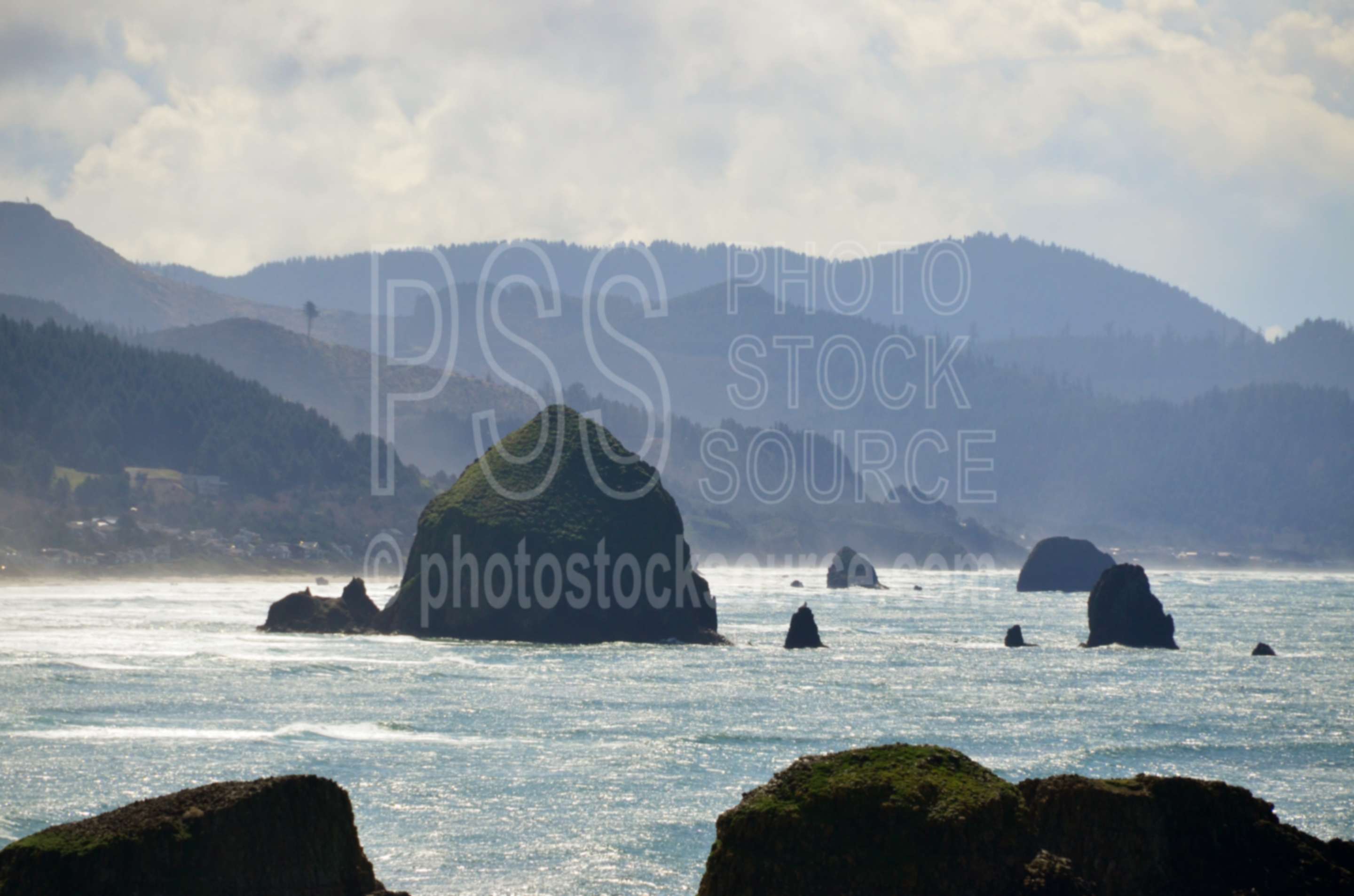 Haystack Rock,rocks,seastacks,coast,beach,clouds,haystack rock,coastline,ocean