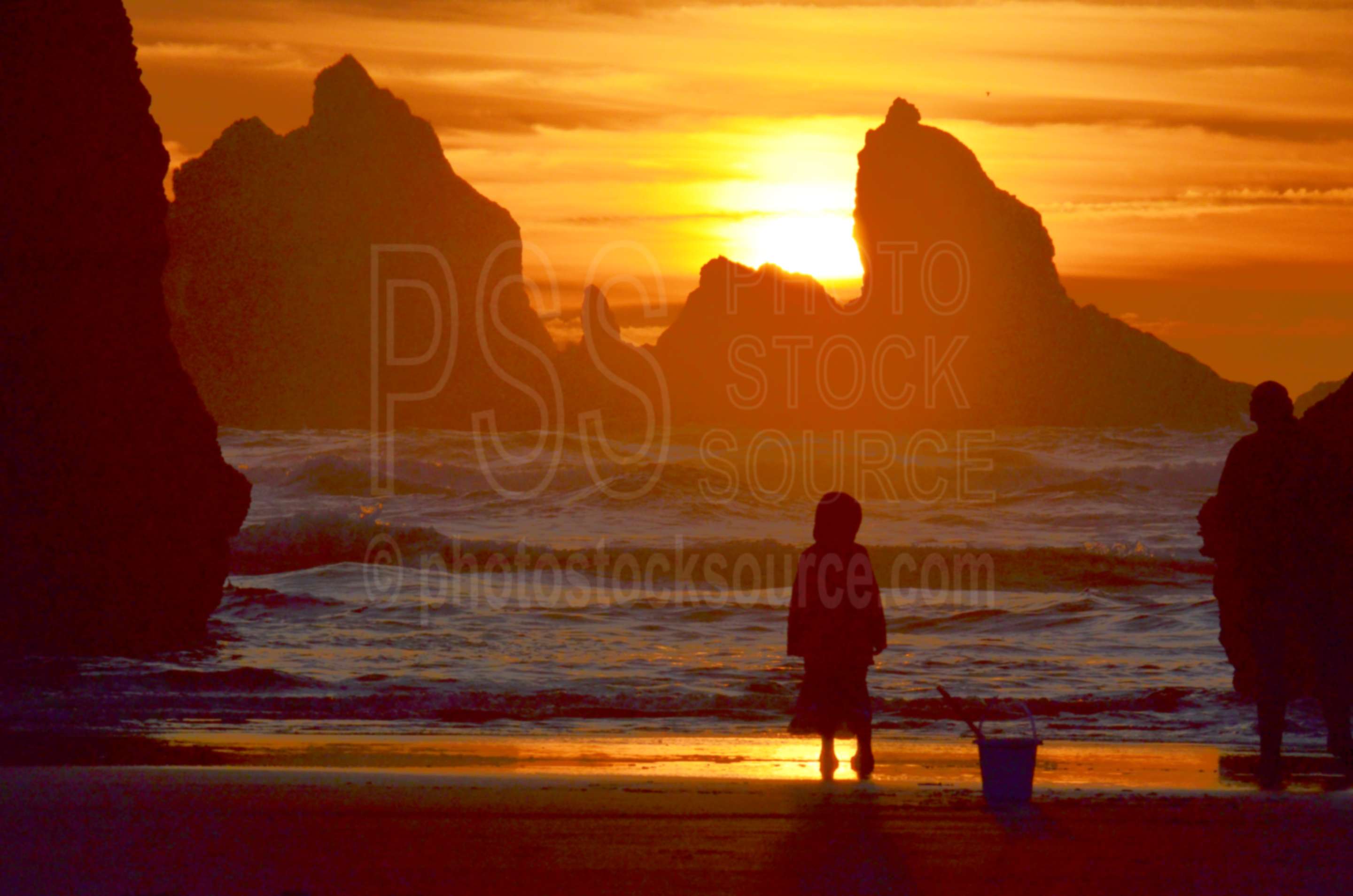 Young Girl Watching Sunset,sea stack,rock,beach,sunset,girl,pail,sand
