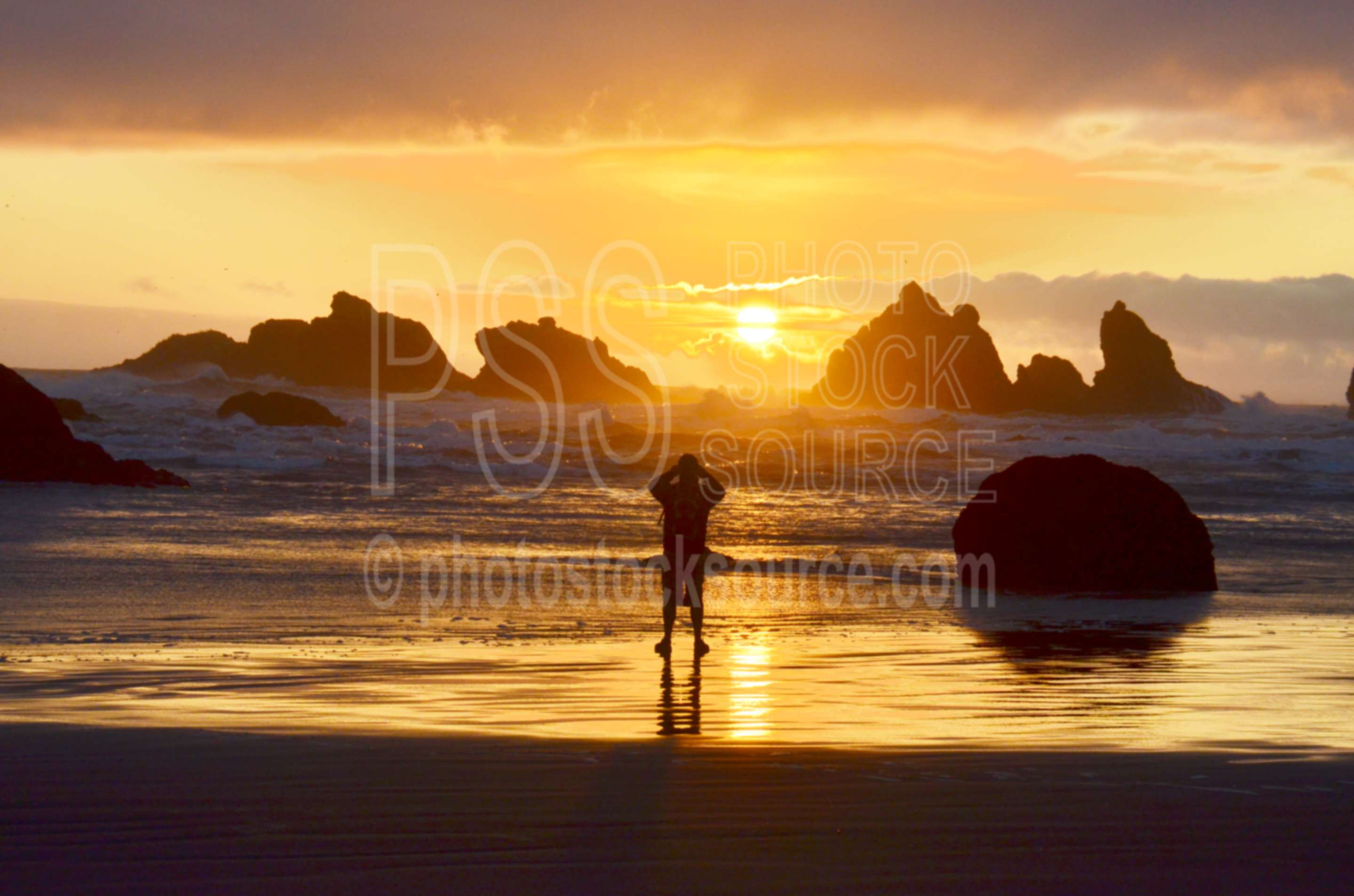 Man Watching Sunset,rock,beach,sand,sea stacks,clouds,sunset,man