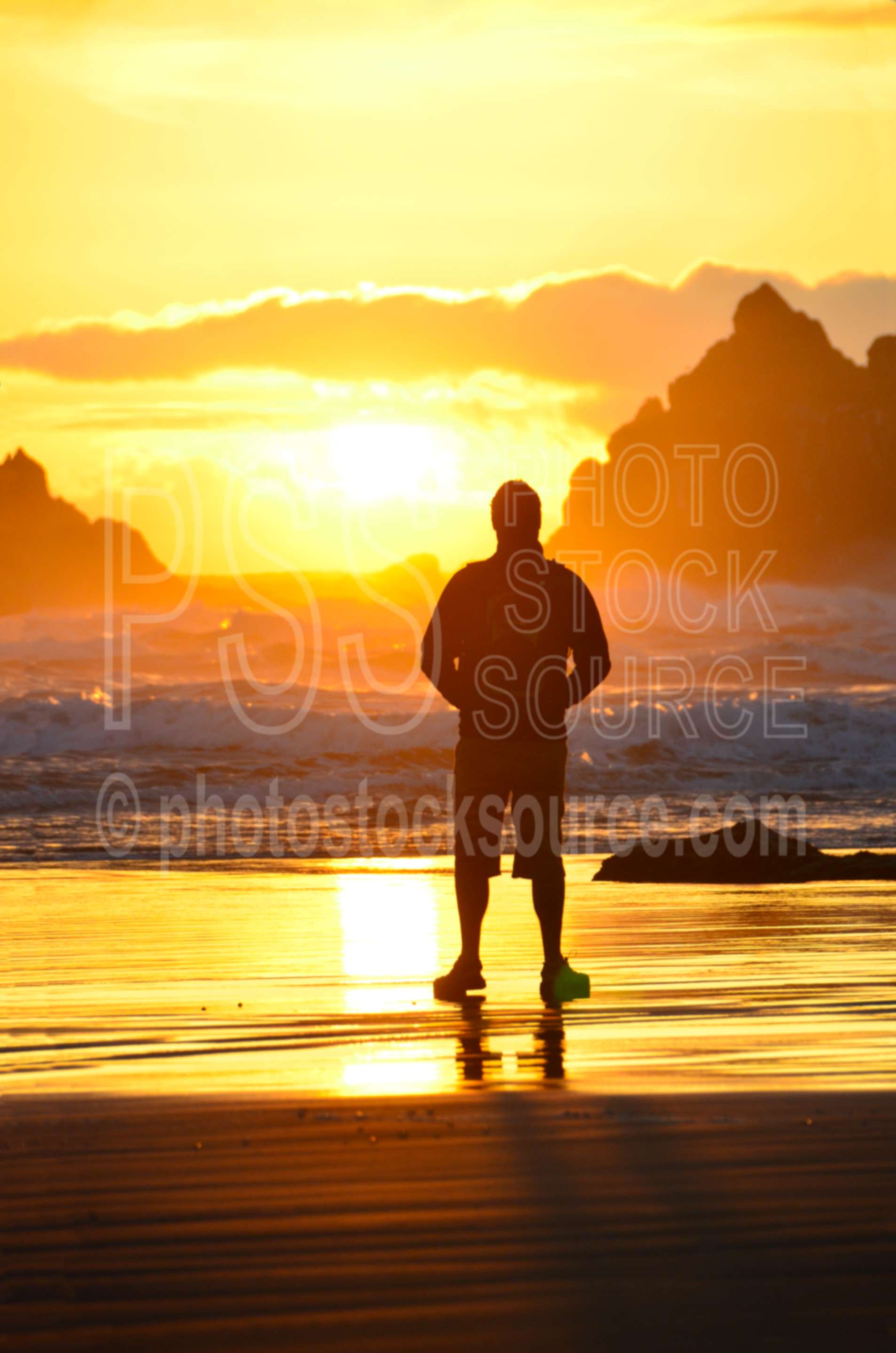 Man Watching Sunset,rock,beach,sand,sea stacks,clouds,sunset,man