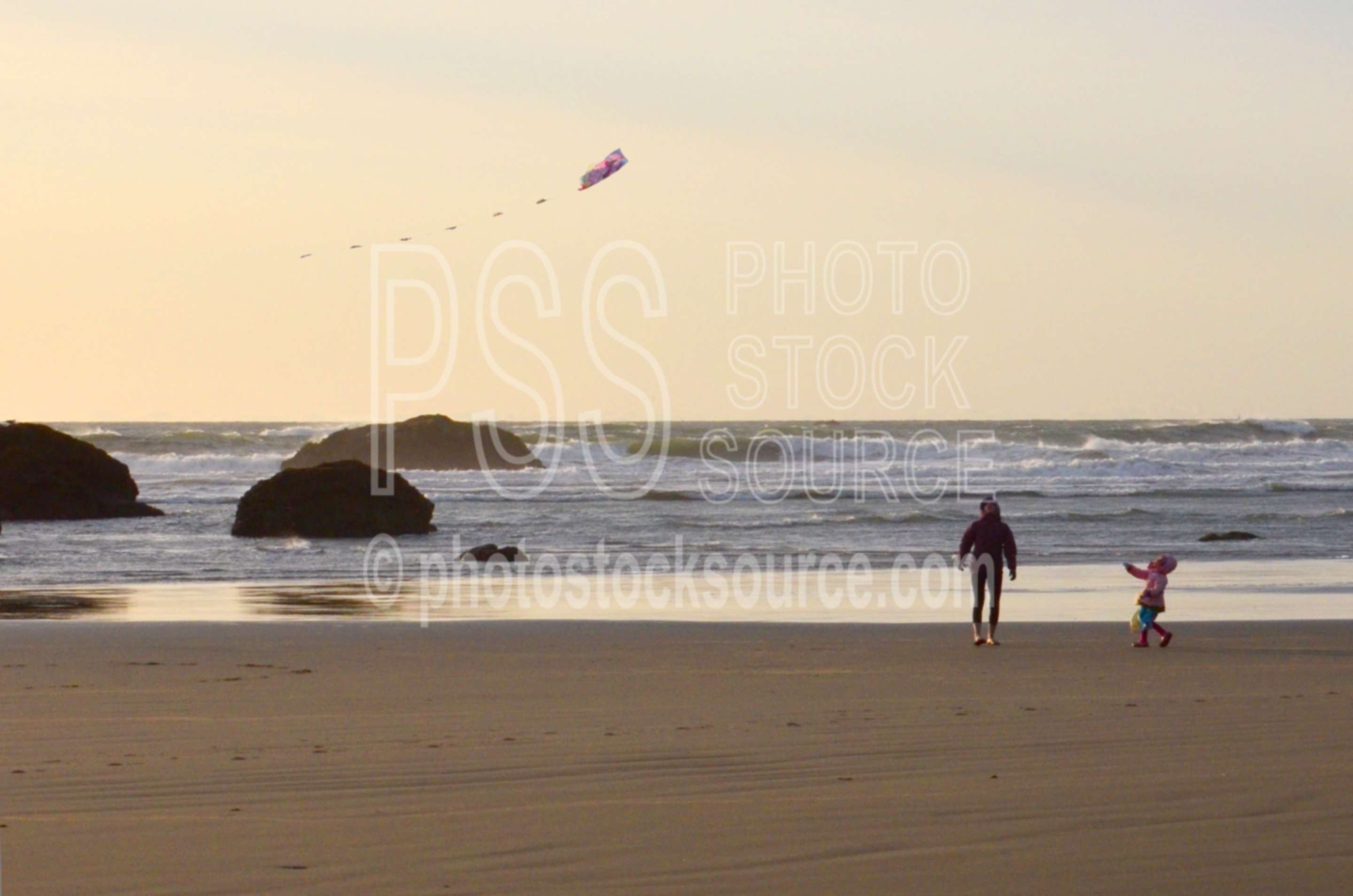 Family Flying Kite on Beach,beach,kite,flying,family,people,playing,rocks,sunset