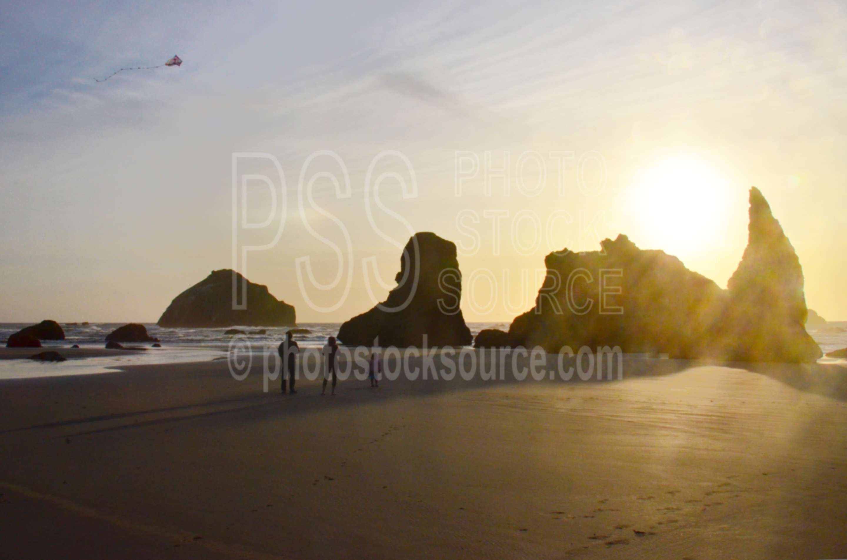 Family Flying Kite on Beach,beach,kite,flying,family,people,playing,rocks,sunset