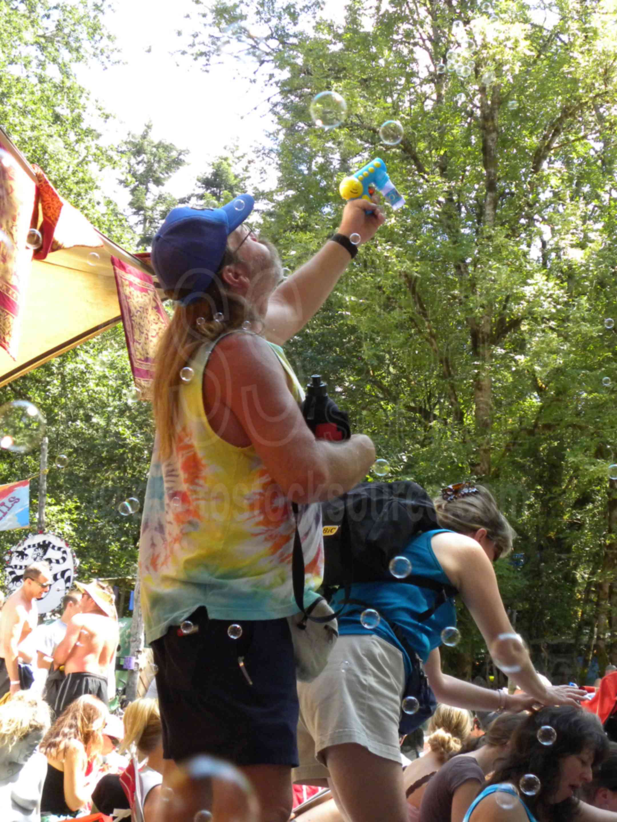 Man Blowing Bubbles,color,fair,faire,festival,gathering,hippy,hippies,celebration,bubbles,blowing bubbles
