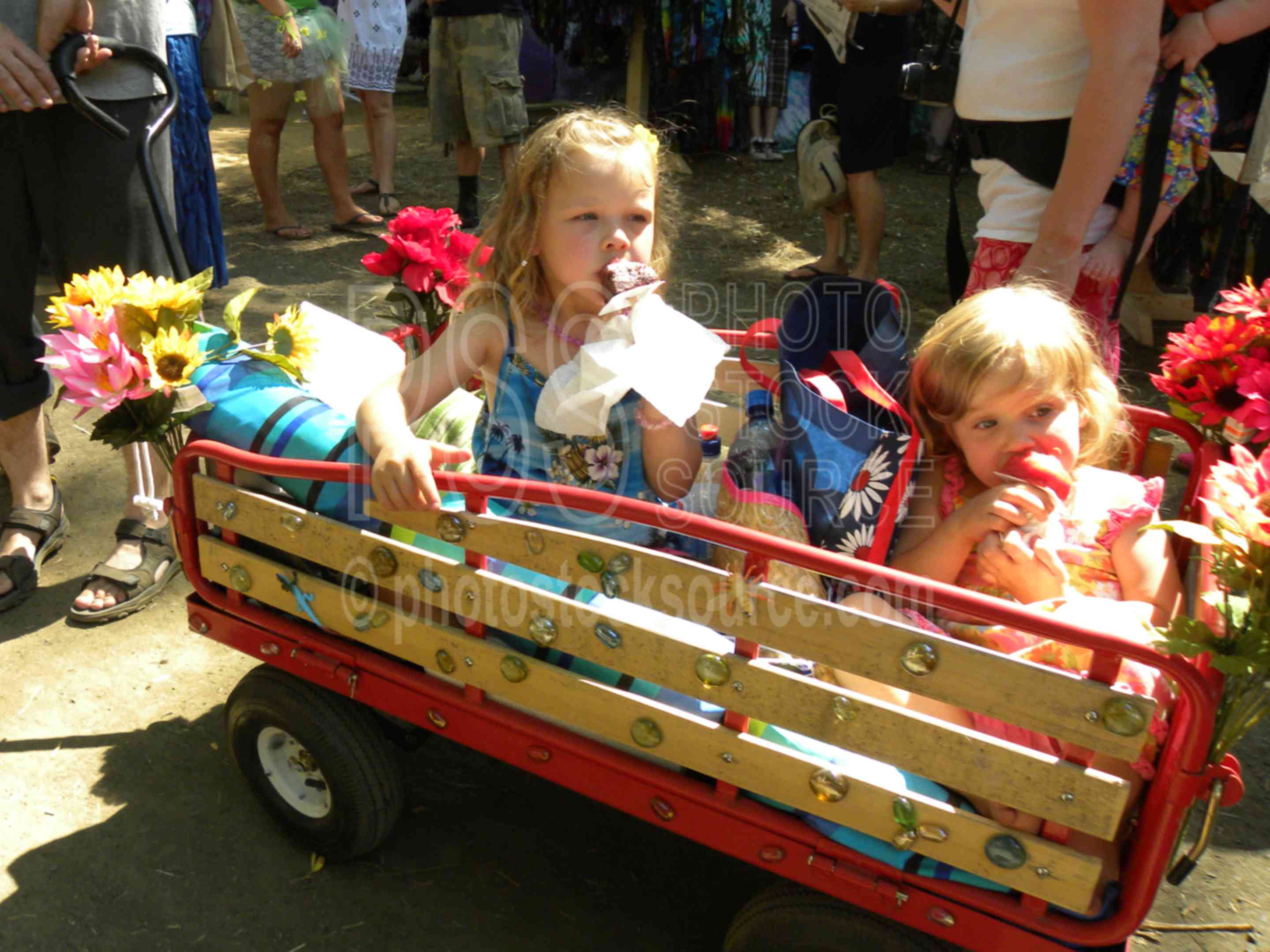 Eating Sweet Treats,color,fair,faire,festival,gathering,hippy,hippies,celebration,wagon,girls,sisters