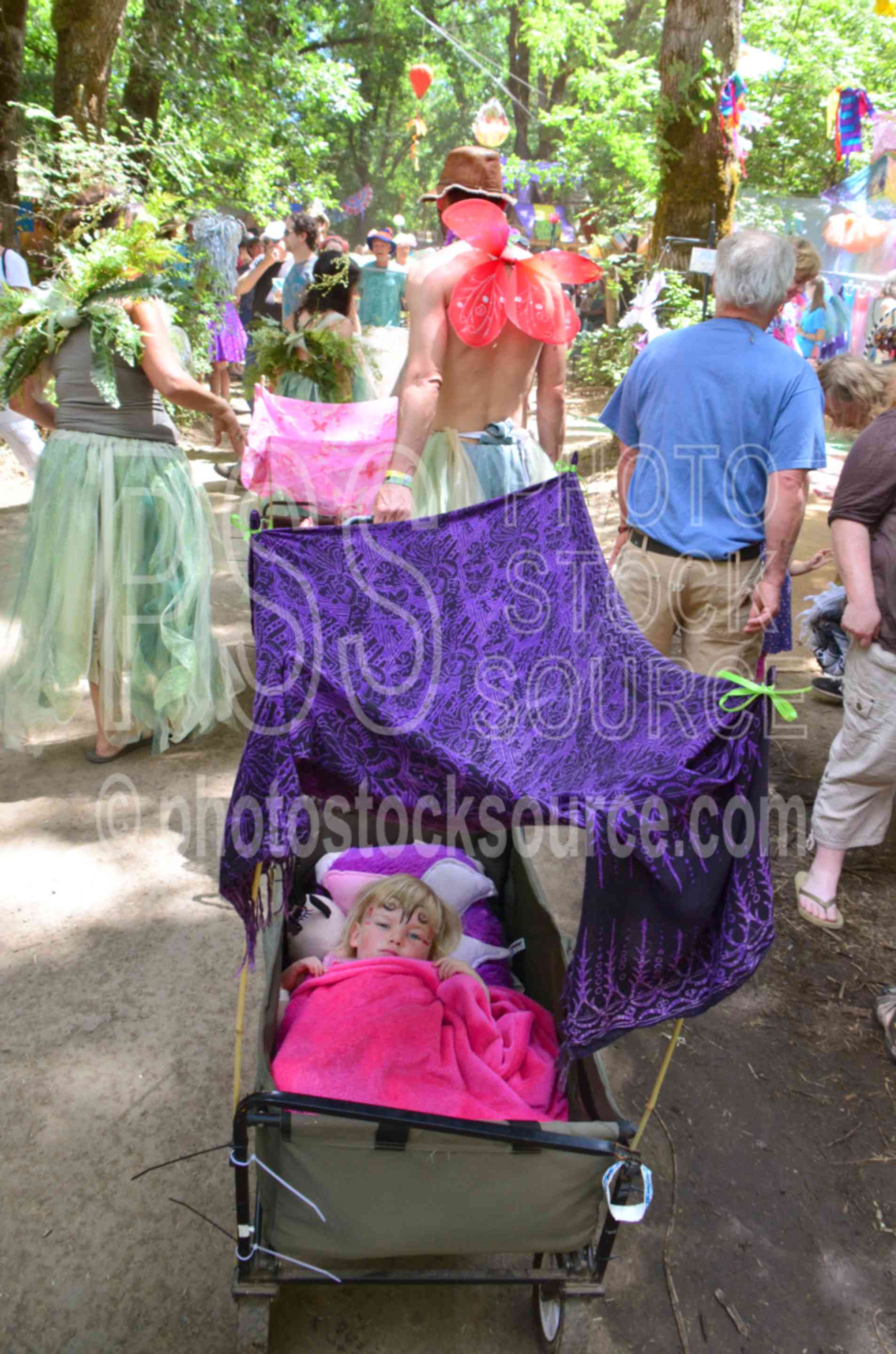 Sleepy Time in a Wagon,fair,festival,people,children,entertainment