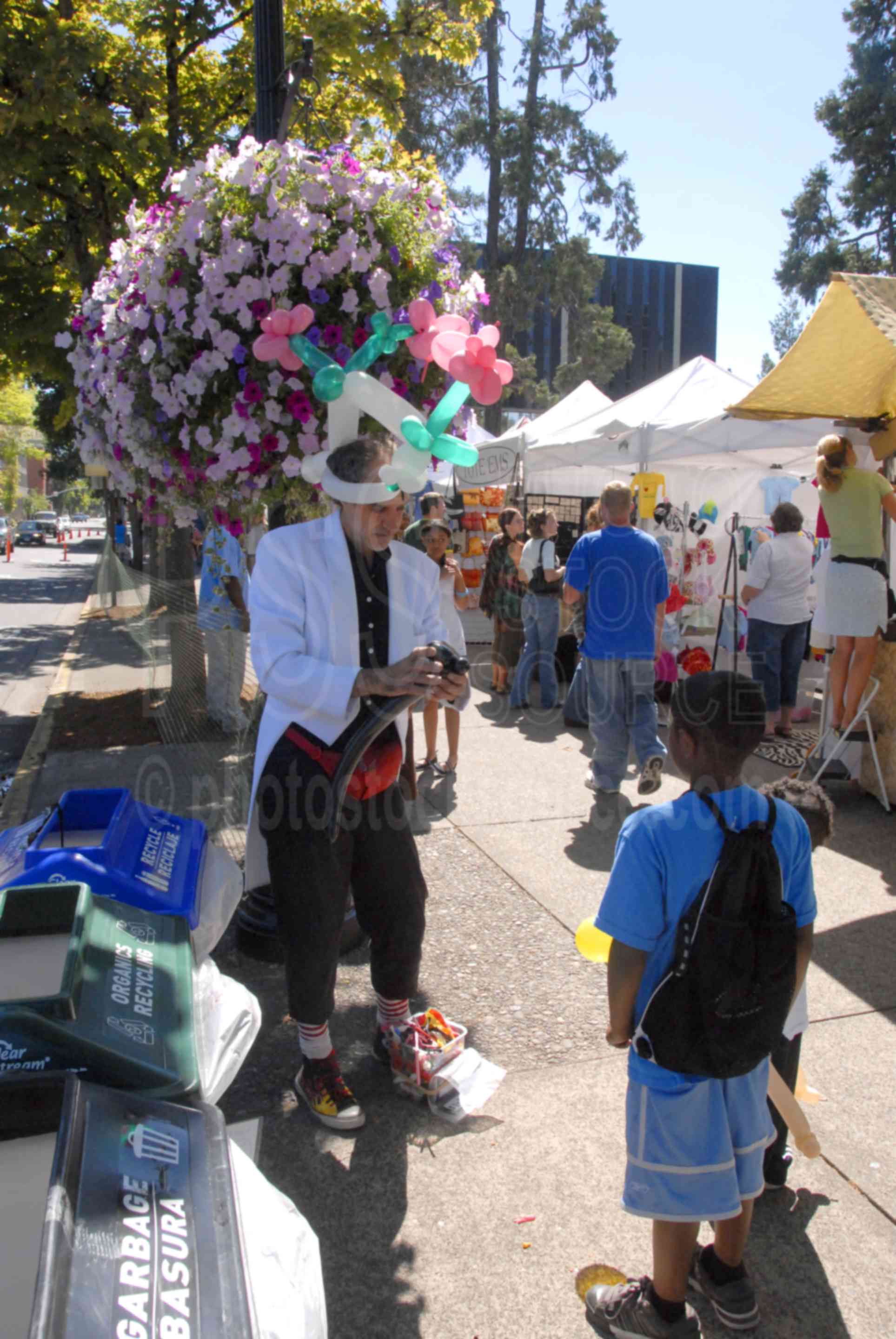 Eugene Saturday Market,people,market,vendor,vendors,selling,arts,crafts,booths,music,food,entertainment,gathering,street performer,entertainer,boy